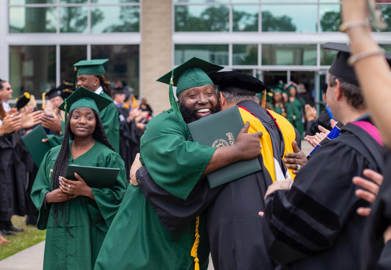 Graduate hugs professor